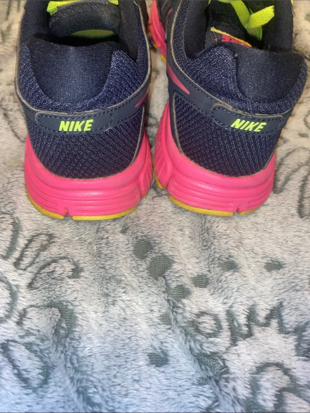 Nike women’s Navy Sneakers with Neon Green Laces and Pink Accents